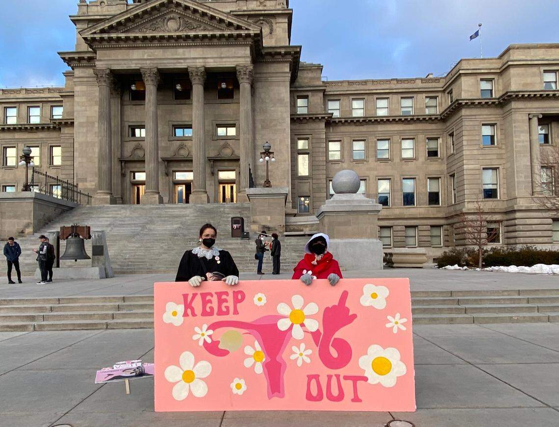 Julia Ballenger, 28, and Lisa Hunter, 37, pose outside the Idaho State Capitol Saturday after the sixth annual Idaho Women’s March.