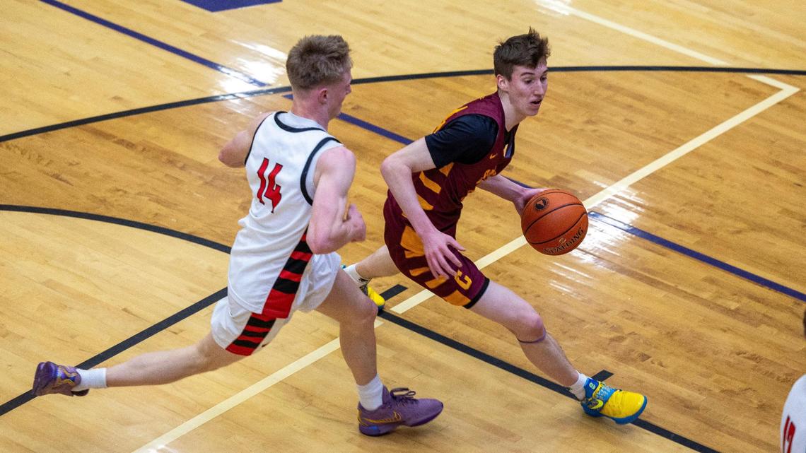 Columbia sophomore Max Keller dribbles past Hillcrest’s Mason Saunders during the first round of the 5A state tournament at Rocky Mountain High School. Keller led the Wildcats with 18 points.