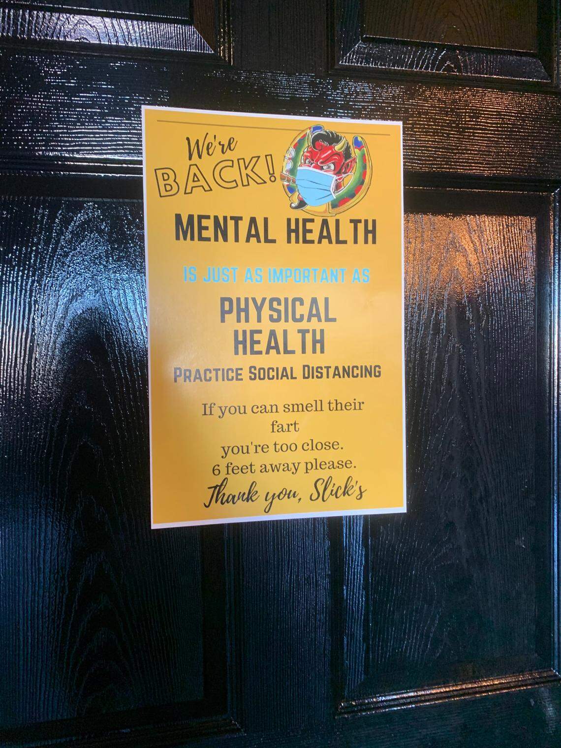 Slick’s Bar in Nampa placed a sign in the bathroom about social distancing, but its owner has said that governing whether people stay 6 feet apart is not her role.