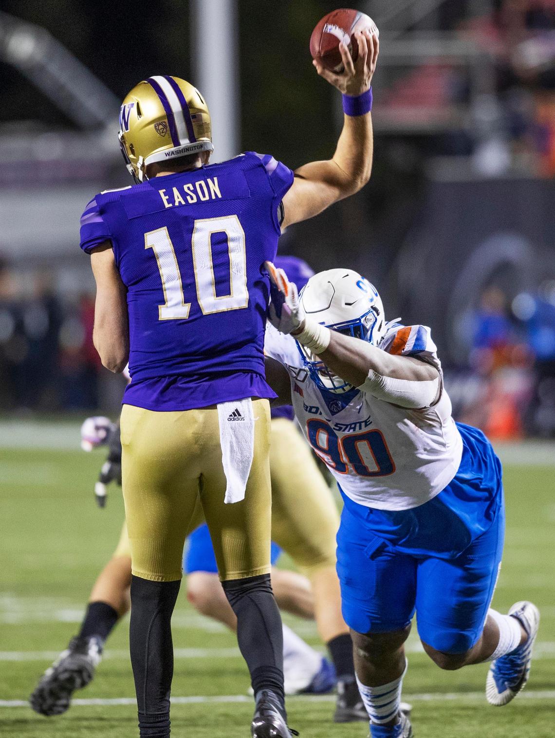 Boise State nosetackle Scale Igiehon (90) forces a bad throw by Washington quarterback Jacob Eason (10) in the third quarter of the Las Vegas Bowl Saturday, Dec. 21, 2019 at Sam Boyd Stadium in Las Vegas, Nev.