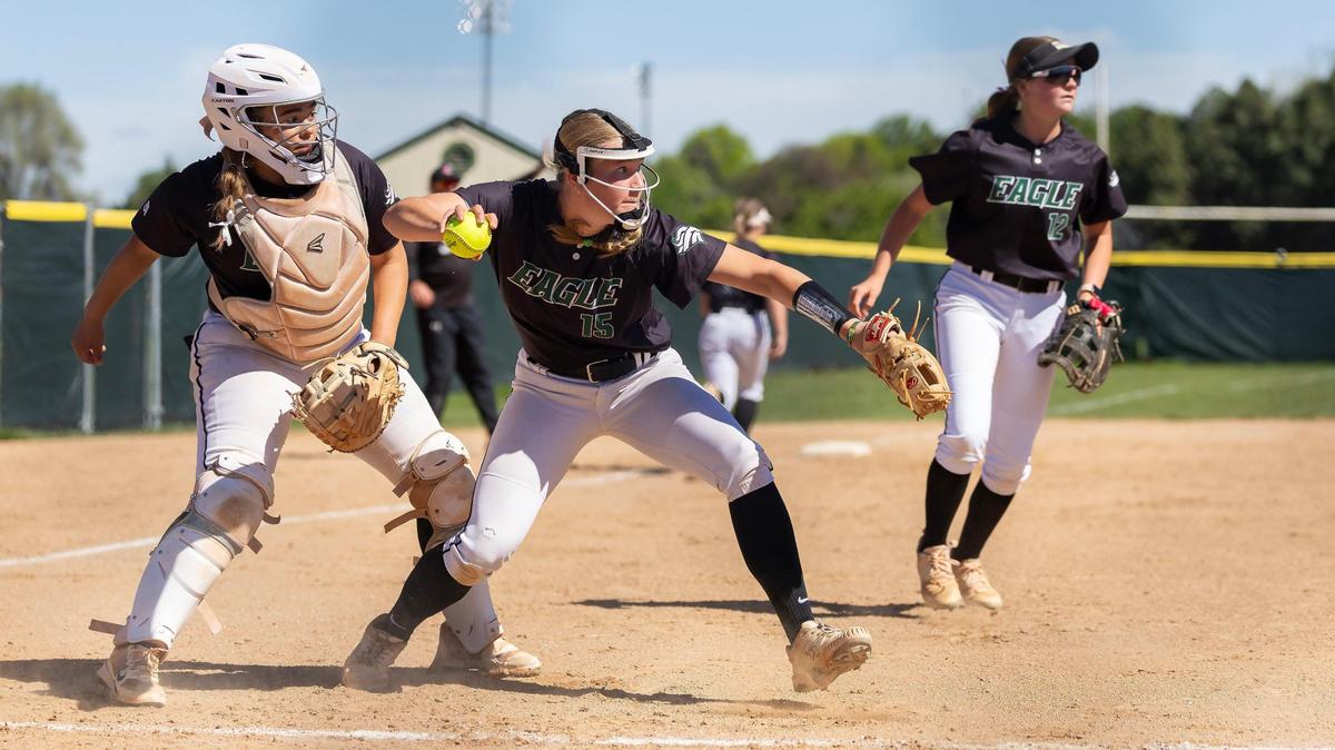 Eagle pitcher Peyton Bargen, center, fields a bunt and throws out the Owyhee runner at first base Tuesday.
