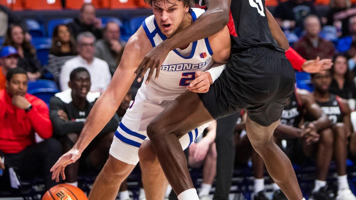 Boise State forward Tyson Degenhart draws a foul on Cal State Northridge forward Dearon Tucker on a baseline drive Nov. 29 at ExtraMile Arena in Boise.