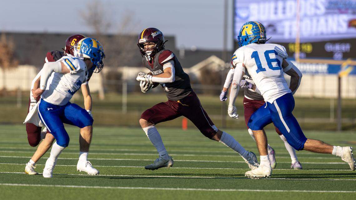 Nampa Christian senior running back Ian Johnson carries the ball in the fourth quarter during the 3A state football championship against Ririe, Saturday, Nov. 22, 2025 at Middleton High School.