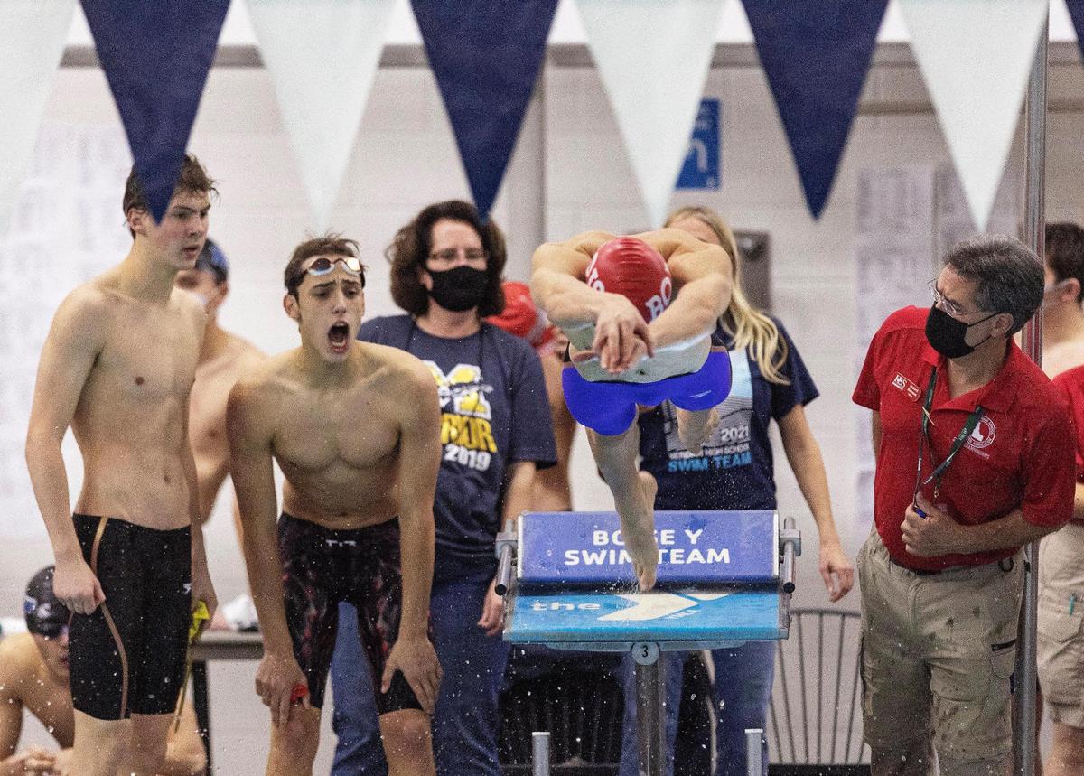 Milo Shue dives into the pool as part of Boise’s state champion 200-yard medley relay team Saturday at the state swim meet at the West Boise YMCA.