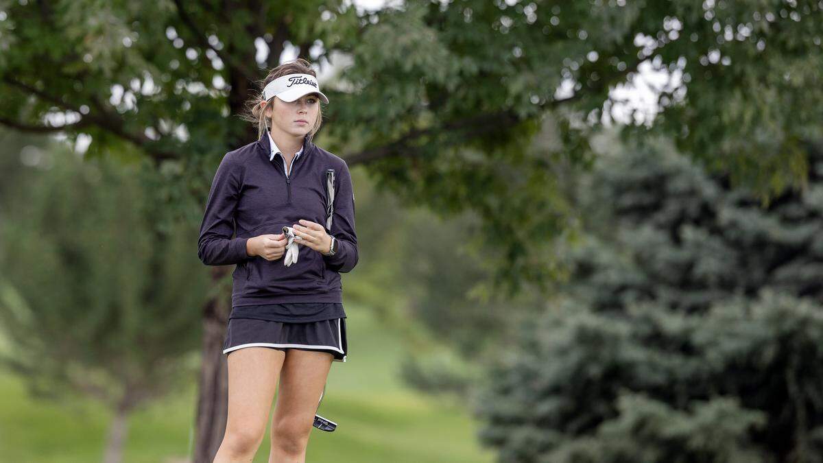 Bishop Kelly's Cara Carter watches her foursome finish putting on No. 4 during the 5A District Three Golf Tournament held at TimberStone Golf Course in Caldwell, Wednesday, Oct. 1, 2025.