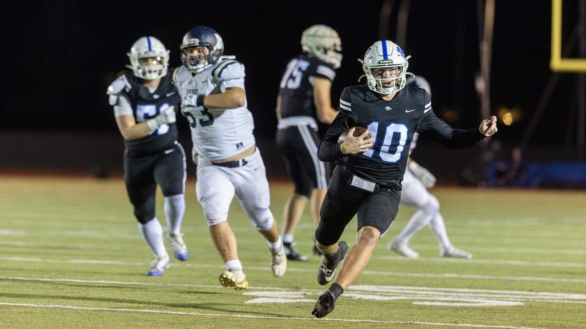 Timberline senior quarterback Jack Brant carries the ball in the first quarter of their game against Middleton in the 6A football state quarterfinals, held at Dona Larsen Park, Friday, Nov. 7, 2025.
