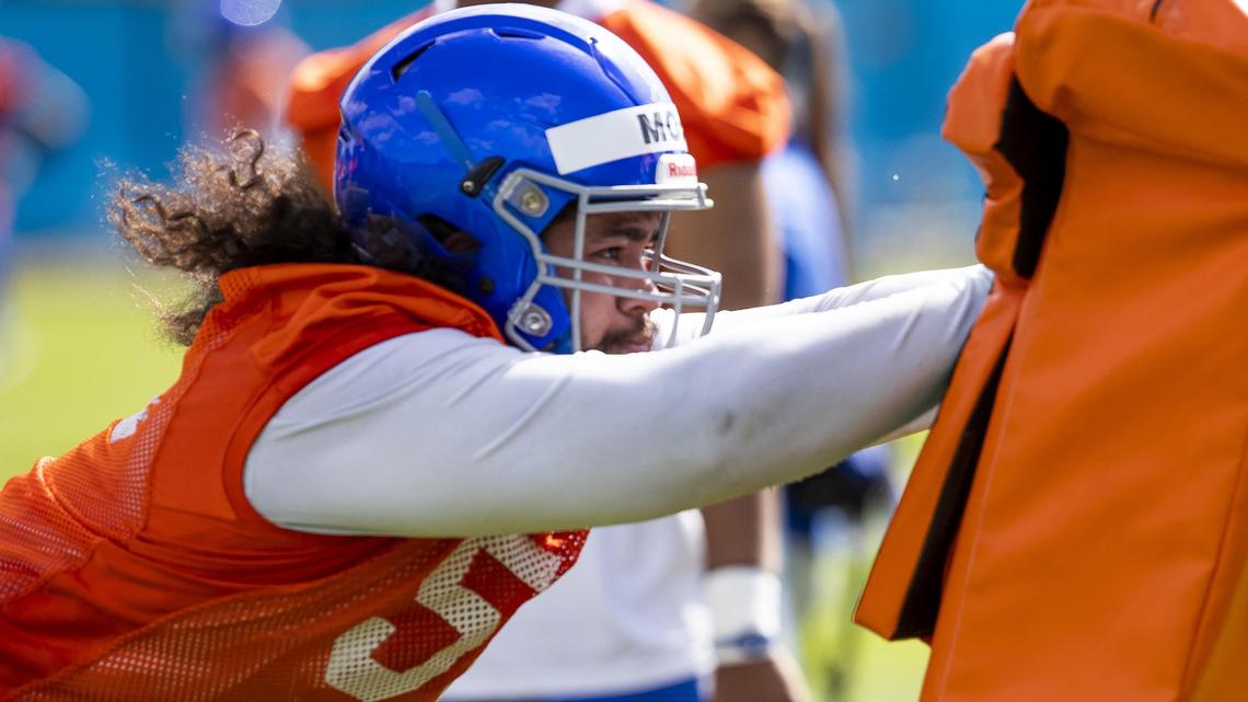 Boise State defensive tackle David Moa attacks a blocking sled during the Broncos’ fall camp Friday, Aug. 2, 2019.