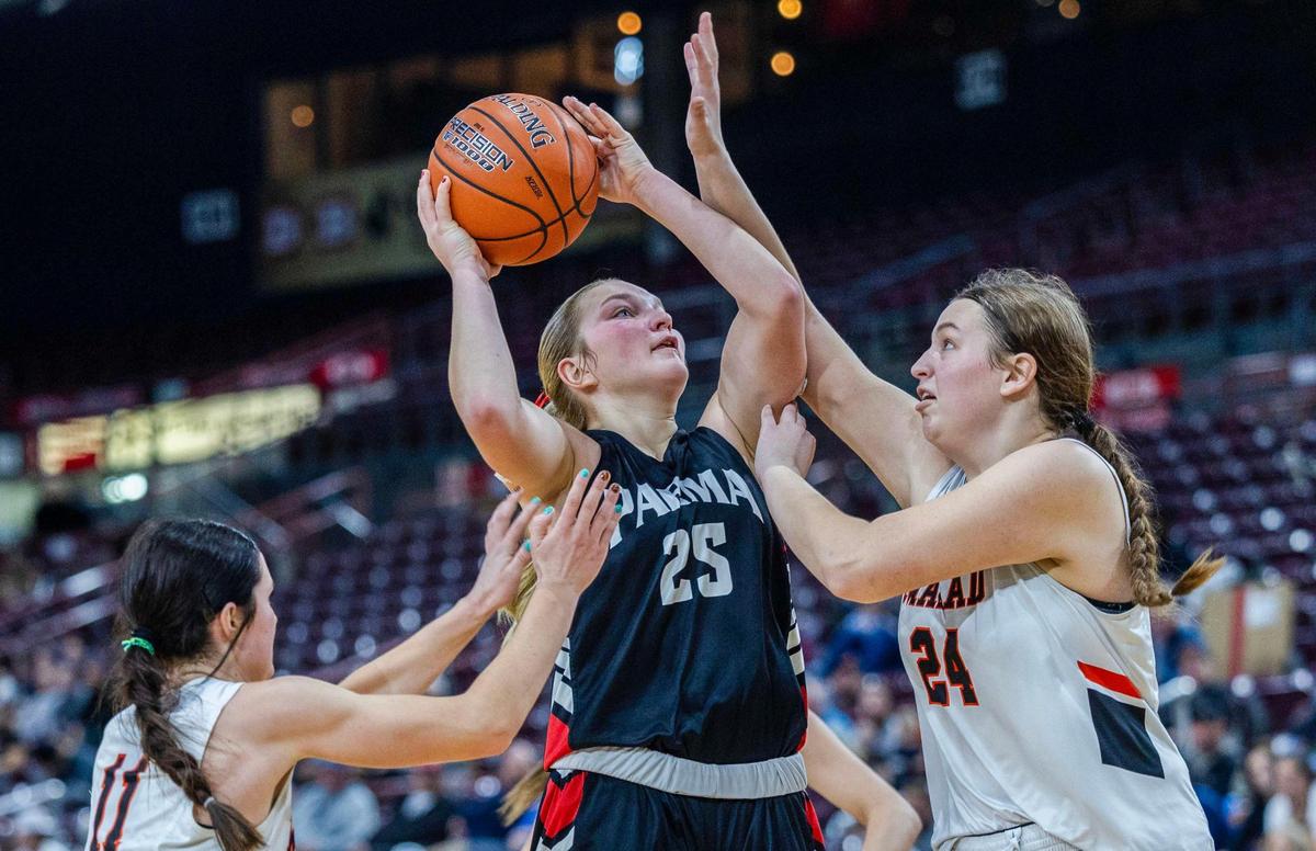 Parma forward Aarey Harris draws a foul on Malad’s Olivia Nelson in the 3A state girls basketball championship game last season at Ford Idaho Center in Nampa.