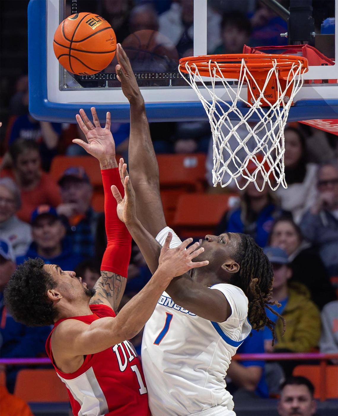 Boise State forward O’Mar Stanley blocks UNLV guard Jailen Bedford in the key during the first half at ExtraMile Arena in Boise, Tuesday, Jan. 7, 2025.
