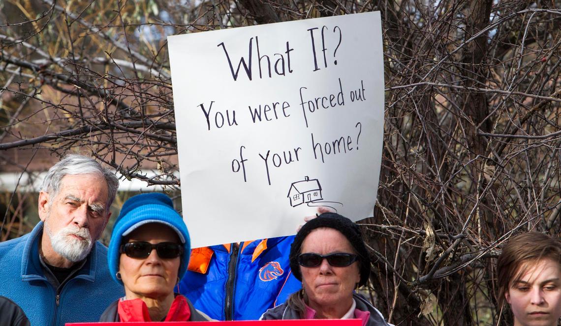Supporters of tenants at the Ridenbaugh Place Apartments rally to oppose a developer’s proposal to raze their units to make way for a big student-apartment building.