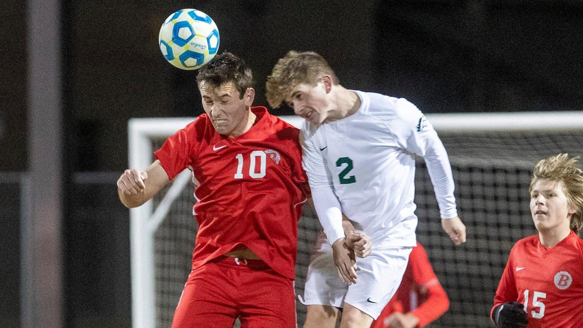 Boise’s Jack Goode, left, and Eagle’s Colton Webb battle for a ball in the air Monday in the 5A state semifinals at Middleton High.
