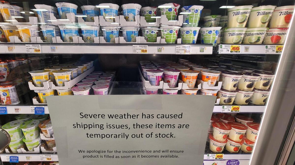 A yogurt cooler at a Fred Meyer store in Garden City was full Tuesday. Signs apologizing for earlier shortages were still in place.