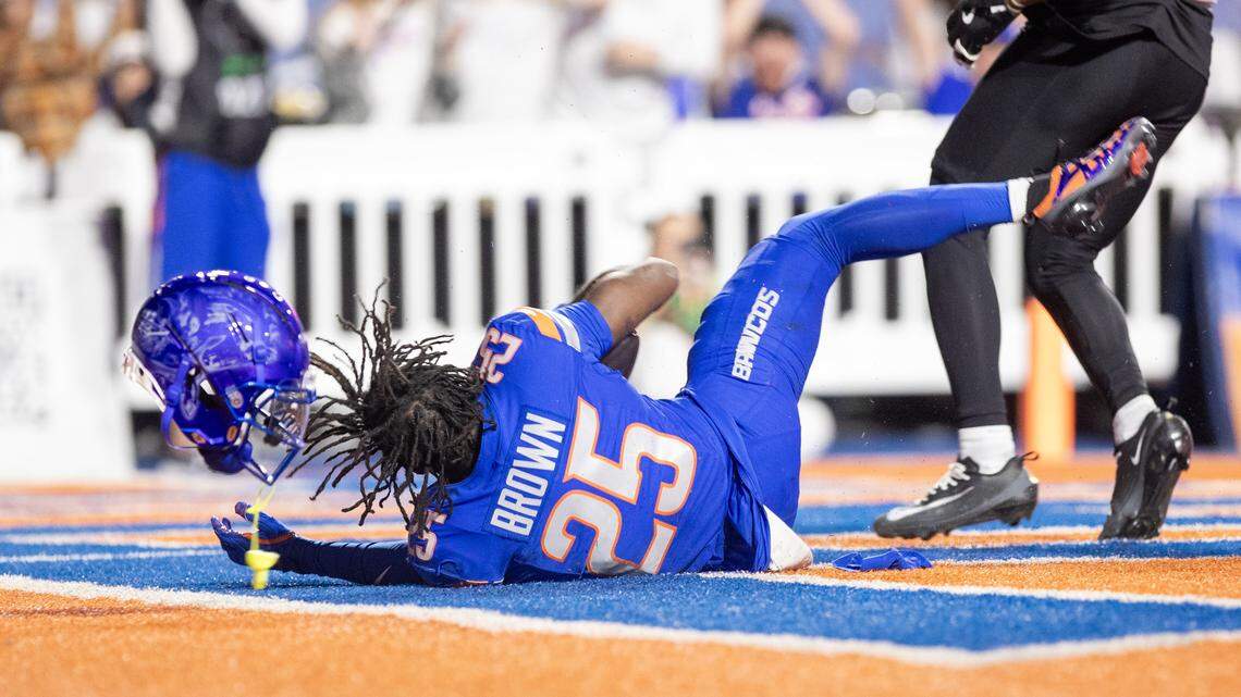Boise State wide receiver Quinton Brown loses his helmet after a 29-yard touchdown grab in the third quarter against App State. It was his first career TD.