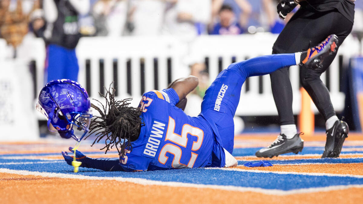 Boise State wide receiver Quinton Brown loses his helmet after a 29-yard touchdown grab in the third quarter against App State. It was his first career TD.