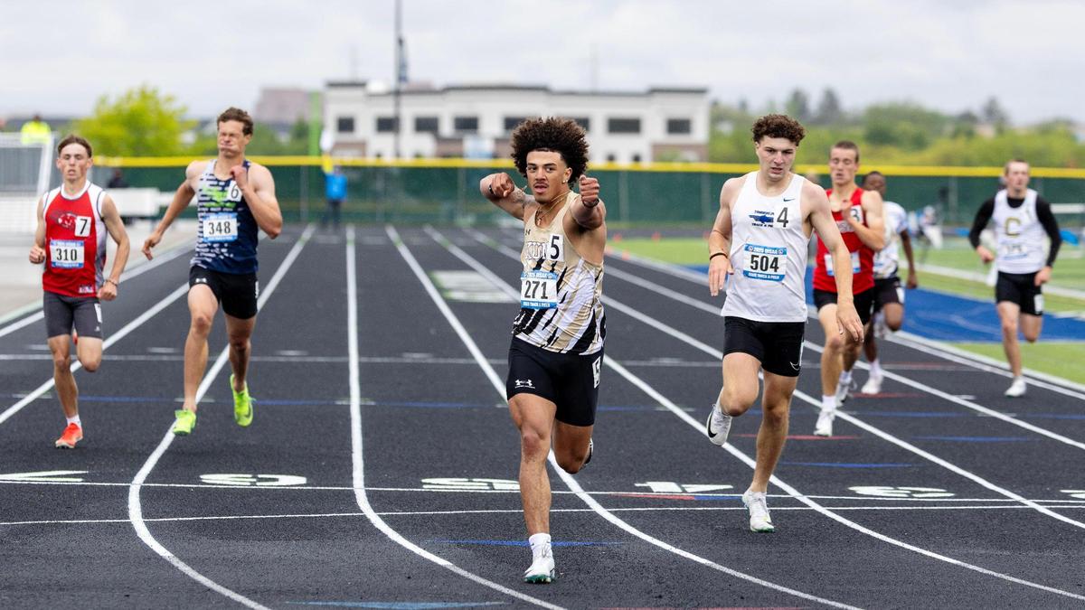 Myles Johnson-Nicholson of Kuna crosses the finish line in first place in the 6A boys 400 meters.