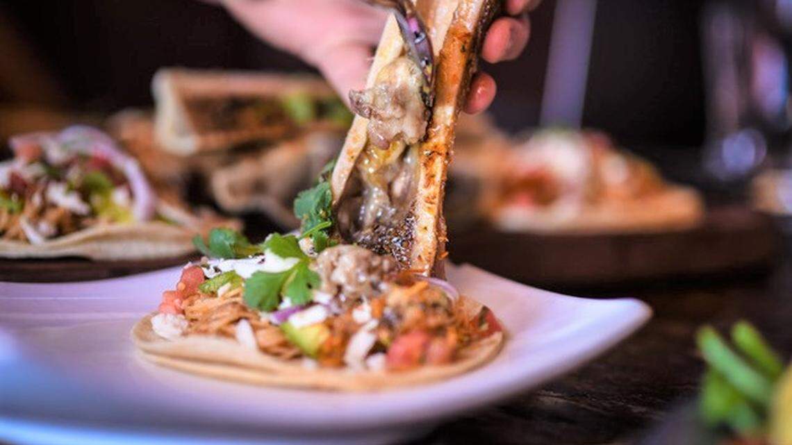 Diners scrape beef bone marrow onto their tacos at the new downtown Boise restaurant.