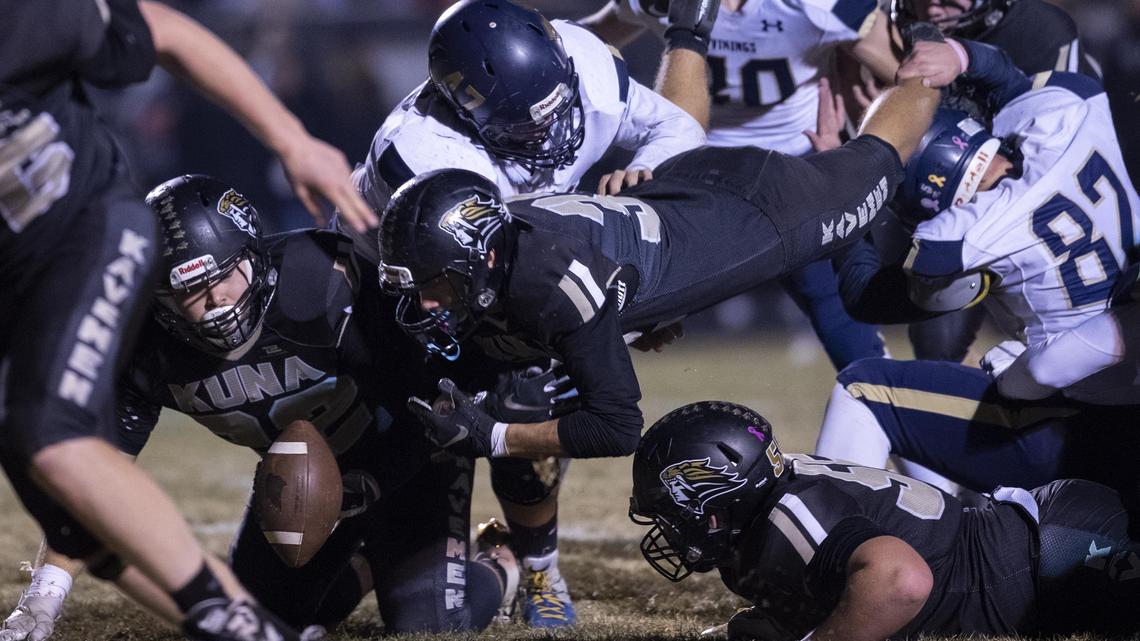 Kuna senior Benten Hall recovers a fumble in the end zone after teammate Jonathan Edwards loses the football at the goal line against Middleton in the 4A state football semifinals Friday at Kuna High School.