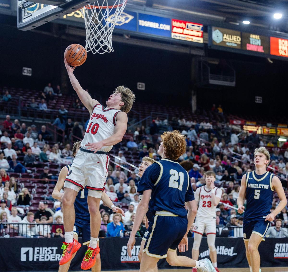 Owyhee sophomore Logan Haustveit scores in the fourth quarter of a 5A state tournament game against Middleton on Thursday at the Ford Idaho Center in Nampa. Owyhee won 62-38.