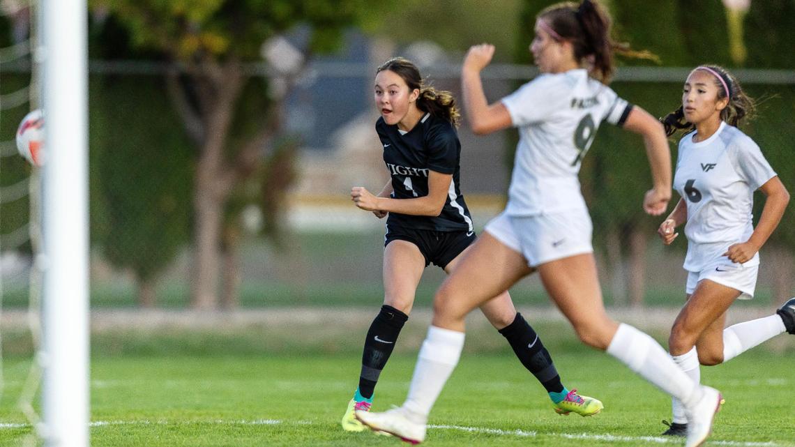Bishop Kelly freshman Kenzie Hill scores the first of her two goals in a 5-2 win over Vallivue in the 4A District Three Tournament championship Thursday at Bishop Kelly.