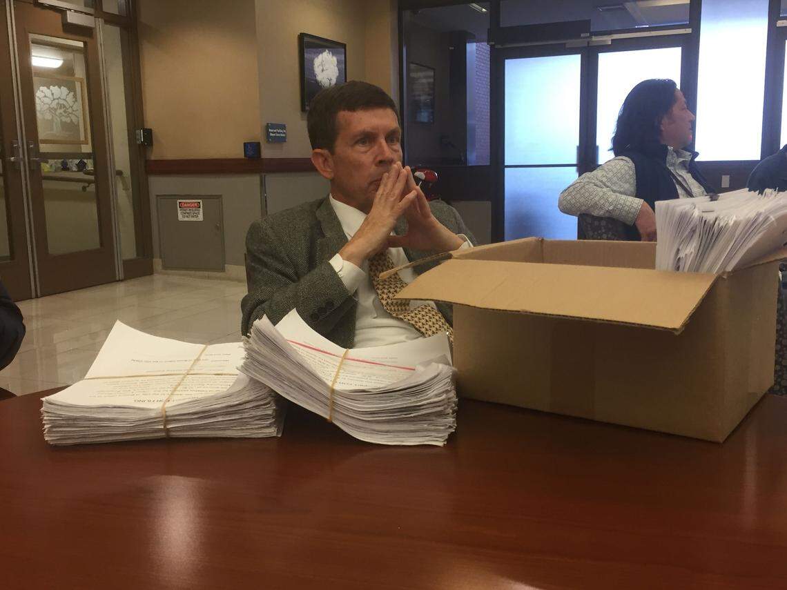 David Klinger, representative of Boise Working Together, prepares to deliver more than 3,000 signatures to the city clerk’s office in April to get the stadium and library projects put on the November ballot.