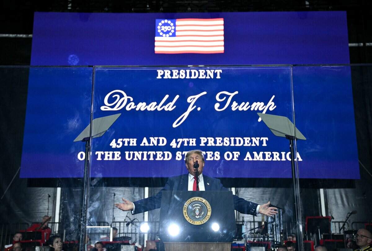 US President Donald Trump speaks behind bulletproof glass during the kick-off celebration for the "Great American State Fair" on the National Mall in Washington, DC, June 24, 2026. The "Great American State Fair" will be held from June 25 to July 10, 2026, to celebrate the 250th anniversary of US independence. (Photo by Mandel NGAN / AFP via Getty Images)