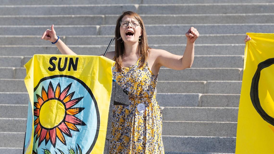 Lisa Young, director of the Sierra Club in Idaho, leads a chant at the rally.