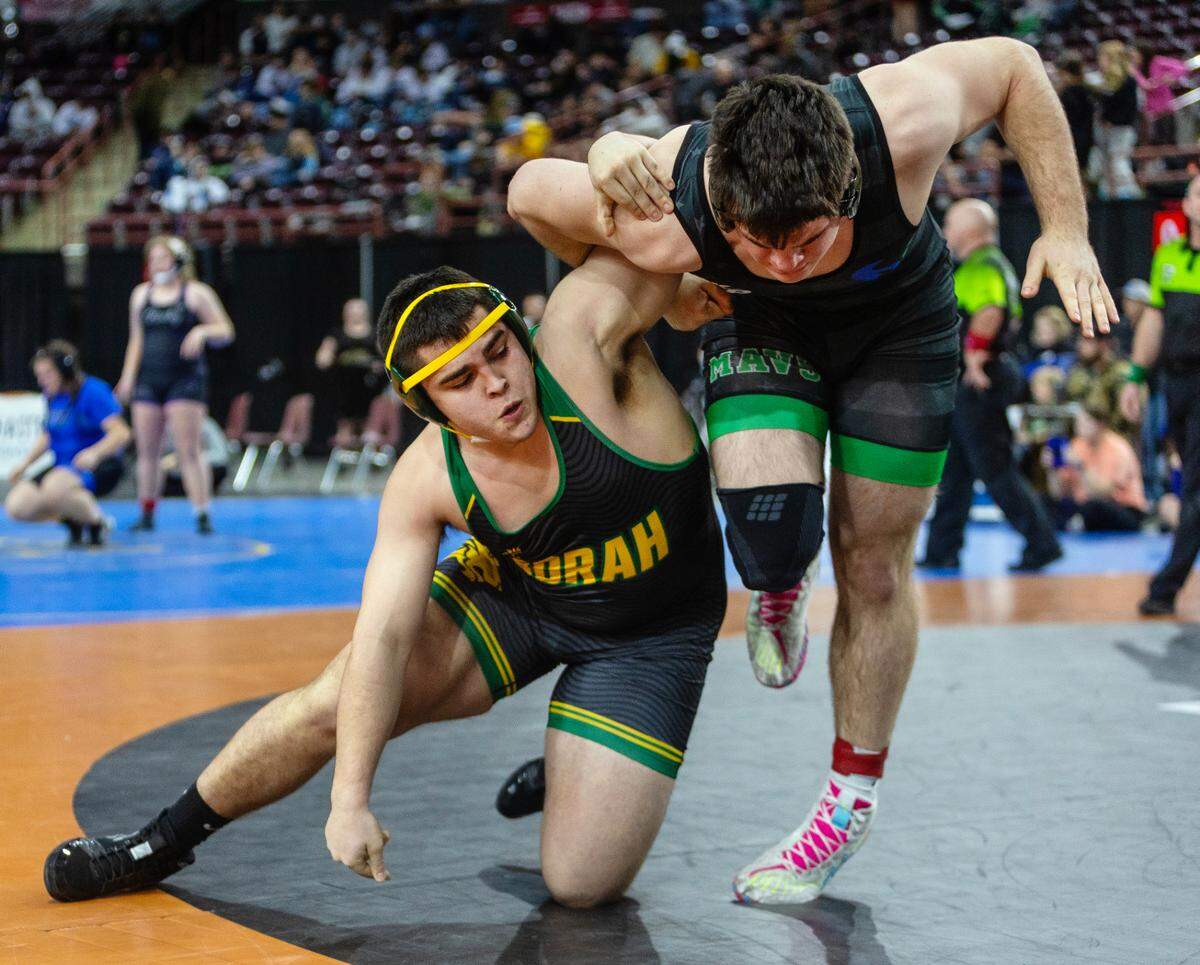 Borah senior Aden Attao, left, enters the 5A state tournament undefeated at 32-0.
