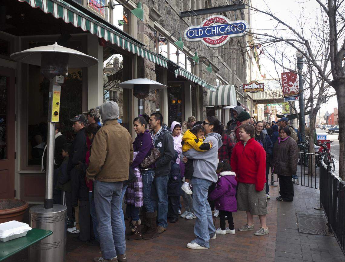 About 1,400 people were treated to a Christmas Day meal at Old Chicago in 2011. Volunteers helped serve food and deliver gift bags filled with clothing, shoes, Albertsons Gift Cards and more.