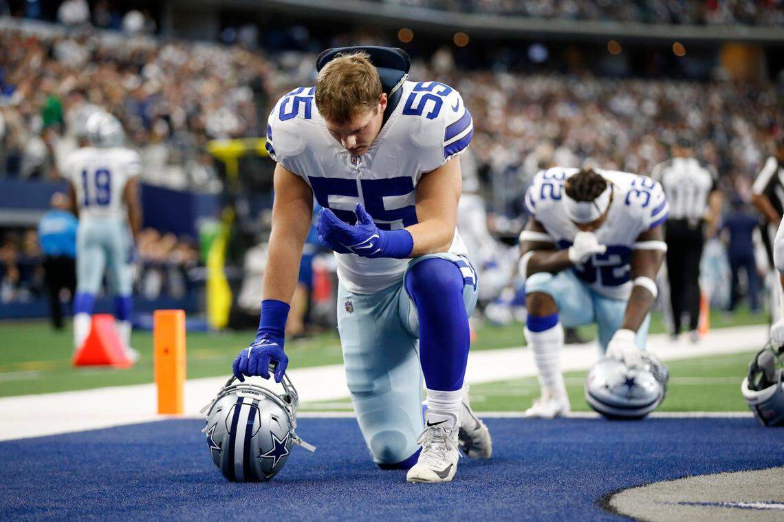 Dallas Cowboys linebacker Leighton Vander Esch kneels in the end zone before the start of an NFL game against the Atlanta Falcons on Sunday in Arlington, Texas.
