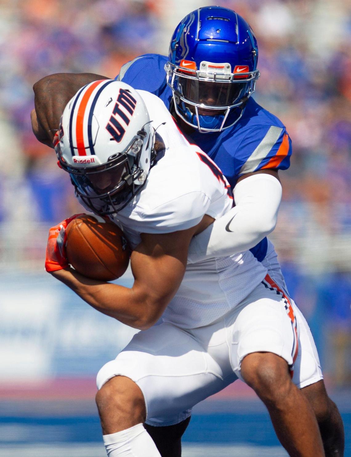 Boise State cornerback Caleb Biggers wraps up UT Martin wide receiver Colton Dowell in the first half. Biggers left the game with an injury in the third quarter.