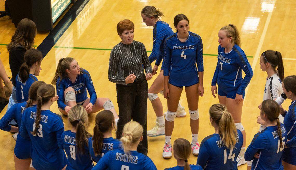Timberline volleyball coach Carol Klein speaks with her players during a timeout in their match during the 2022 season.