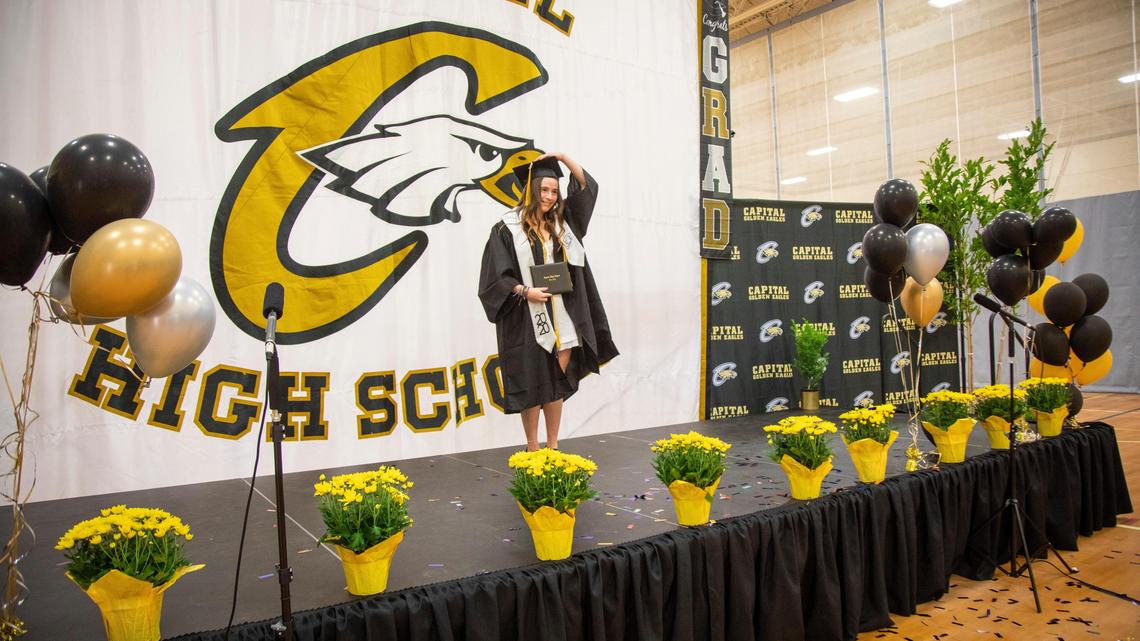 Rami Gonzalez flips her tassel from one side to the graduated side Monday during Capital High School’s graduation ceremony. “It means a lot,” Gonzalez said. “I feel very fulfilled and accomplished. I’m overwhelmed. It’s special. I’m glad I got to see all my teachers one last time.”