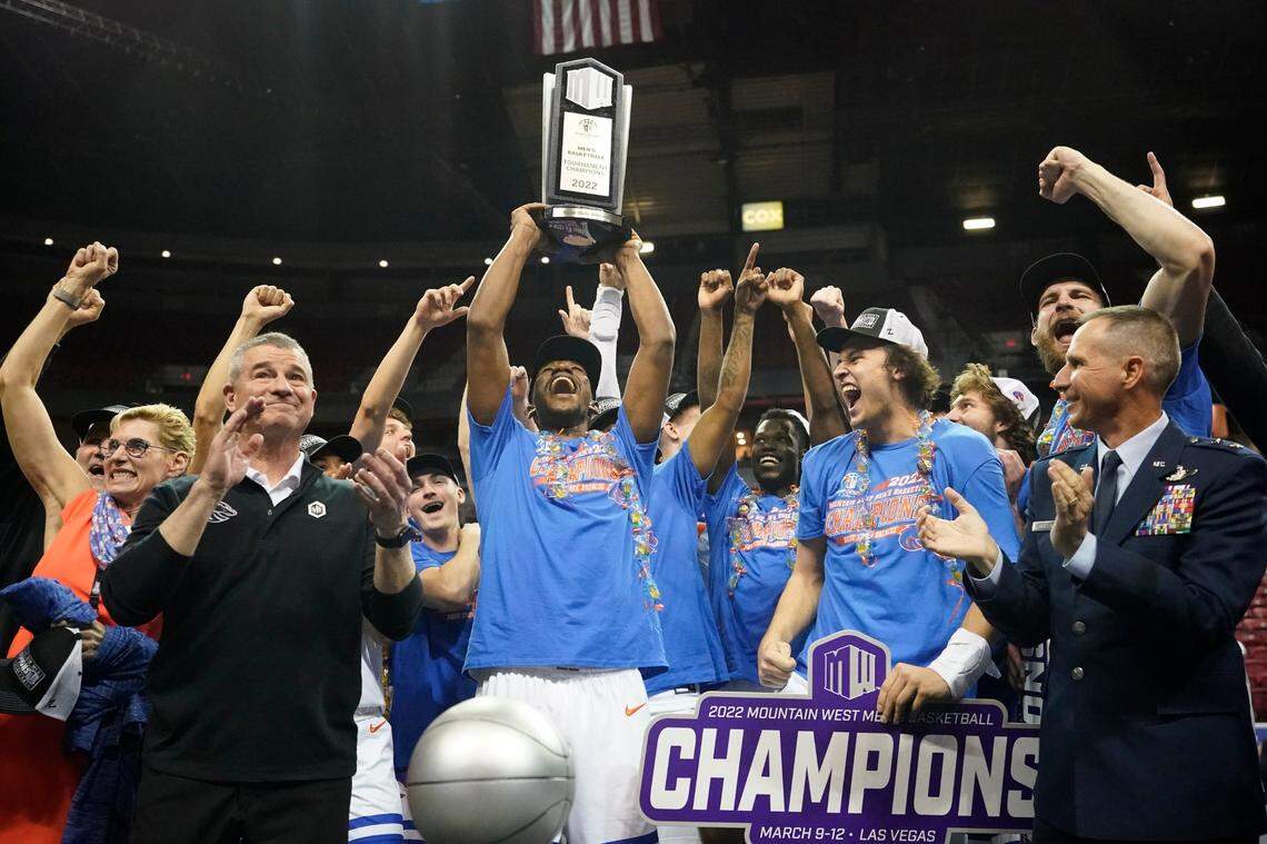 Boise State players celebrate their Mountain West Tournament championship after beating San Diego State on Saturday in Las Vegas.