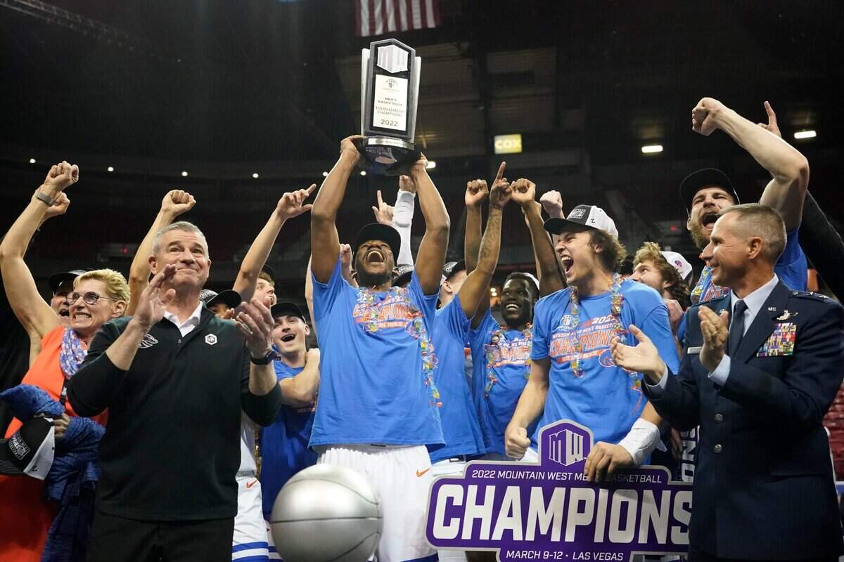 Boise State players celebrate their Mountain West Tournament championship after beating San Diego State on Saturday in Las Vegas.