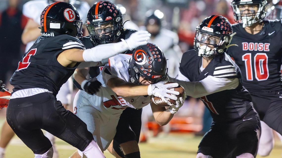 Owyhee junior wide receiver Aidan Joye dives across the end zone for the game-winning touchdown Friday in the Storm’s 28-21, overtime win over Boise at Dona Larsen Park.