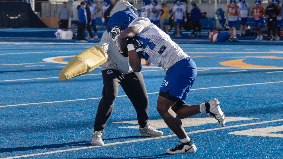 Boise State running back Dylan Riley participates in a drill during spring practice at Albertsons Stadium on Thursday.