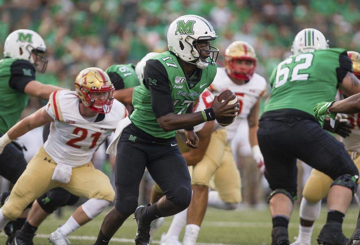 Marshall quarterback Isaiah Green scrambles upfield on a keeper against VMI.