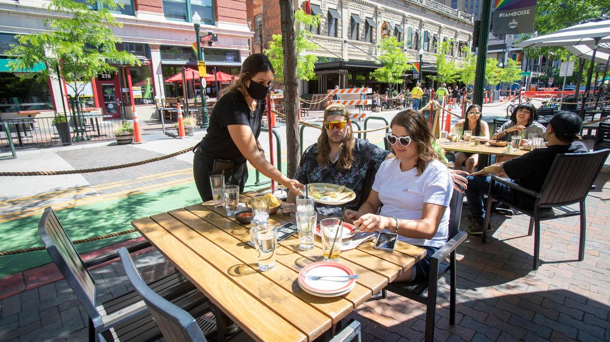 In this 2020 file photo, John Carlson and Kathryn Richie enjoy the patio at The Matador on 8th Street. Two of that restaurant’s neighbors, Red Feather Lounge and Juniper, closed last year but are returning in April.