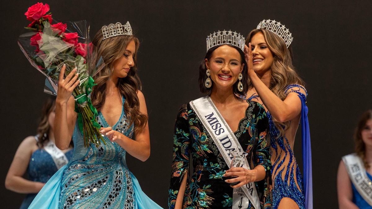 The new Miss Idaho USA 2024 Kaitlyn Widmyer, center, is given flowers by Miss Idaho Teen USA 2023 Angelina Ryan, left, and crowned by Miss Idaho USA 2023 Hannah Menzer, right, during the pageant.