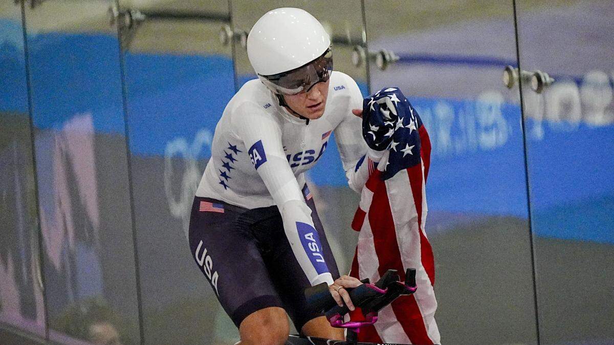 Aug 7, 2024; Montigny-le-Bretonneux, France; Chloe Dygert of Team United States celebrates after winning the gold medal in women's team pursuit during the Paris 2024 Olympic Summer Games at Vélodrome National de Saint-Quentin-en-Yvelines. Mandatory Credit: Andrew P. Scott-USA TODAY Sports