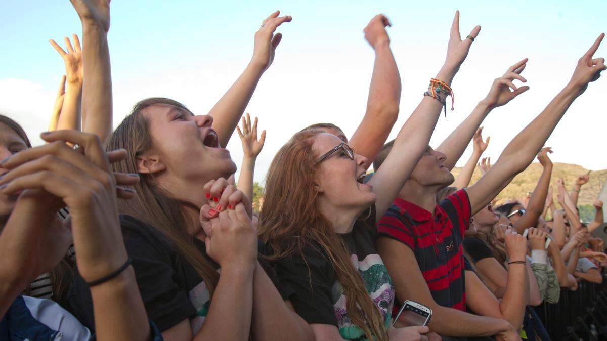 Concertgoers gather in front of the stage at Outlaw Field in Boise.