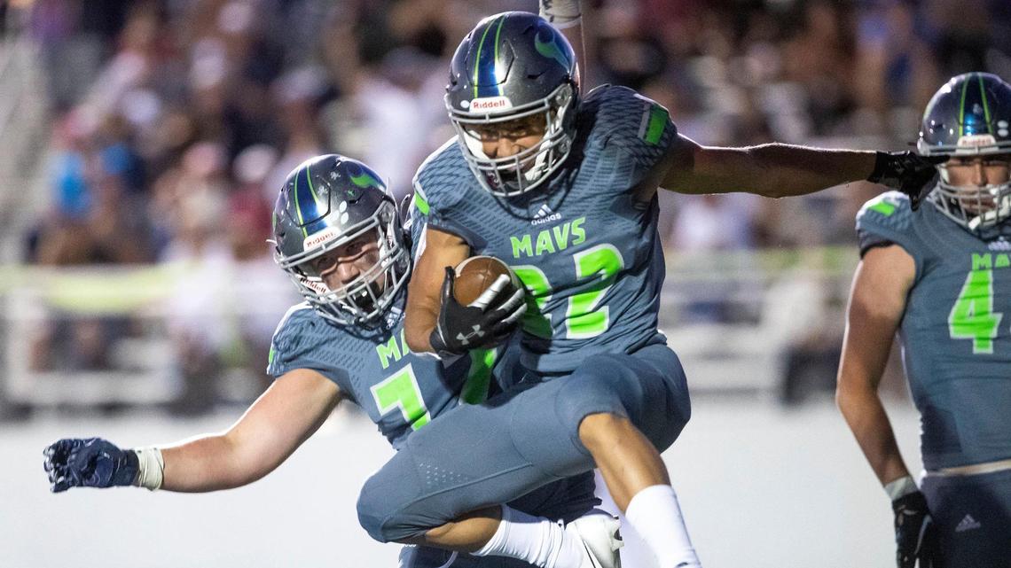 Mountain View running back Dallas Slocum, right, celebrates a touchdown with teammates against Meridian on Aug. 27.