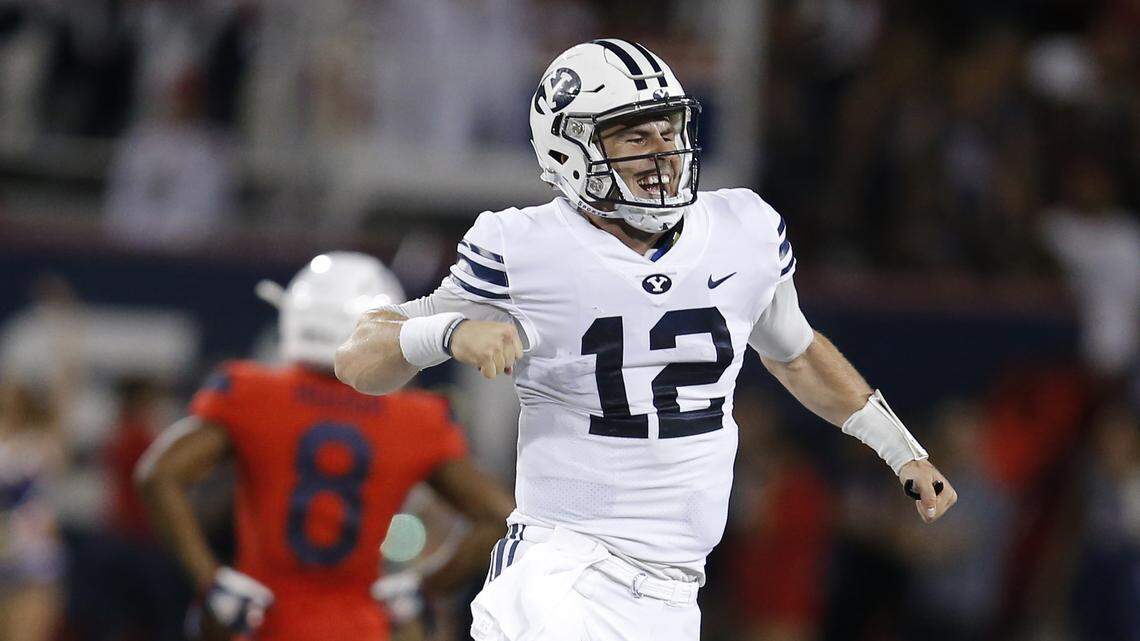 BYU quarterback Tanner Mangum celebrates after defeating Arizona 28-23 on Sept. 1, 2018, in Tucson, Ariz.
