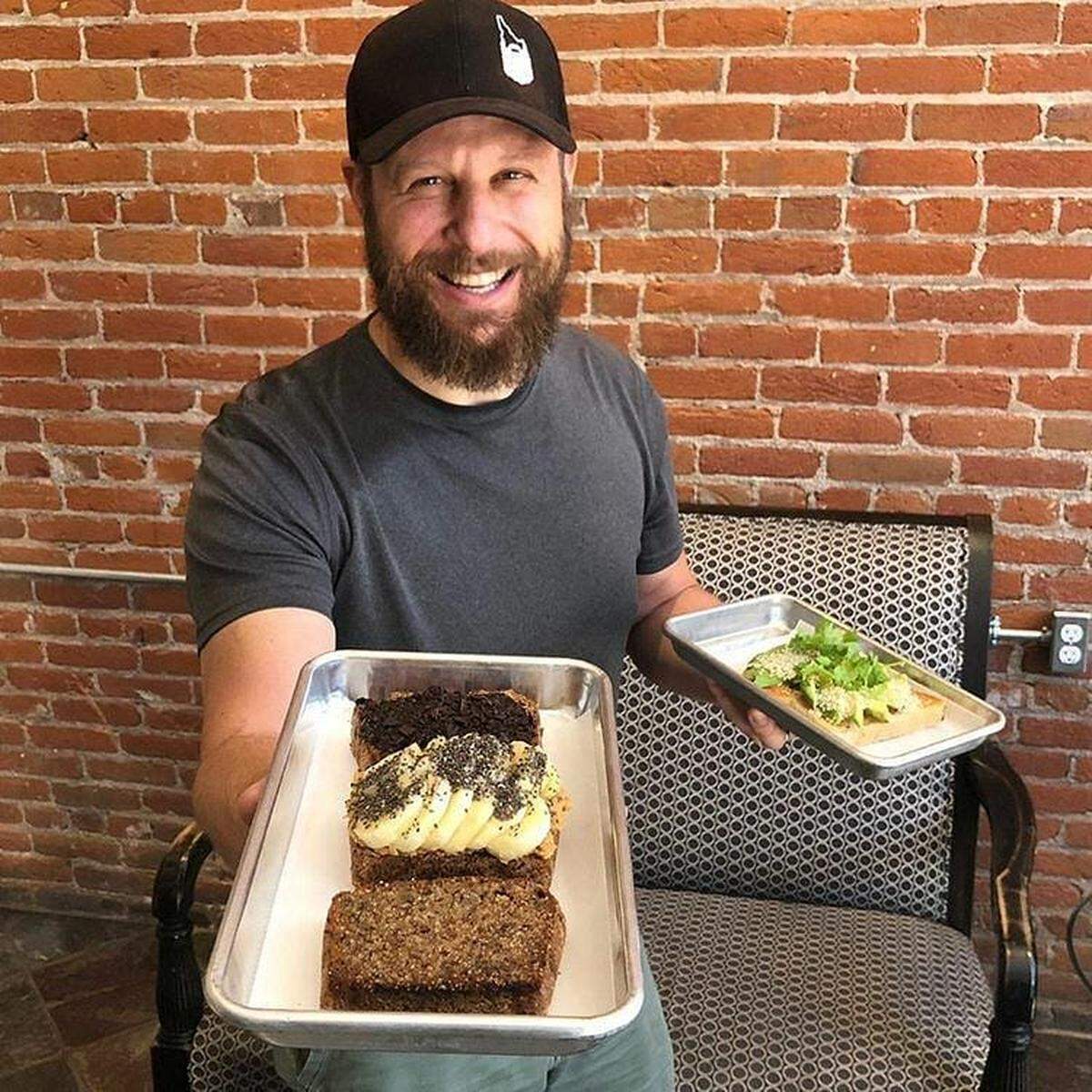Toasted chef and co-owner Brad Wegelin shows off an order of his triple-threat Banana Bread Flight Number 208 ($9.50).