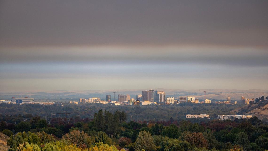 Smoke from the Valley Fire burning in Boise lingers over downtown on Friday.