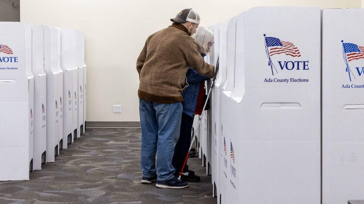Cindy Samuelson, Boise, votes in the 2025 General Election with assistance from her son, Sam Samuelson at the Ada County Election Headquarters polling center in Boise, Tuesday, Nov. 4, 2025.