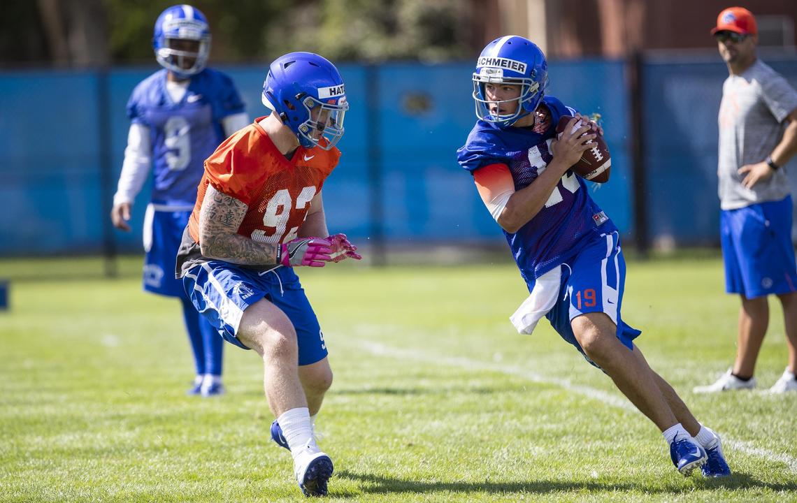 Boise State defensive lineman Chase Hatada pressures quarterback Hank Bachmeier during fall camp on Aug. 2, 2019. “The way and how quickly he learned (the offense) was surprising,” offensive coordnator Zak Hill said.