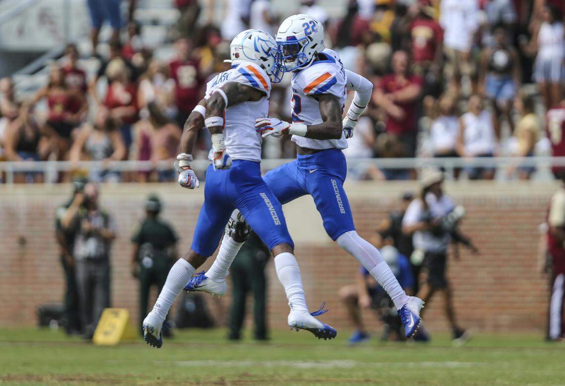 Boise State defensive backs Jalen Walker, left, and Tyric LeBeauf celebrate stopping Florida State’s final drive in the Broncos’ 36-31 win over the Seminoles in the season opener at Doak Campbell Stadium in Tallahassee, Florida.