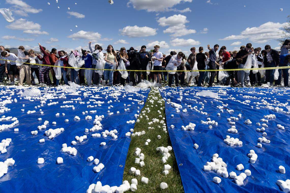 Students at Les Bois Junior High School attempt to break the world record for the largest marshmallow battle, Friday, April 17, 2026. The student body threw 2270 pounds, or approximately 145,000 marshmallows at each other on a makeshift battlefield behind the school.