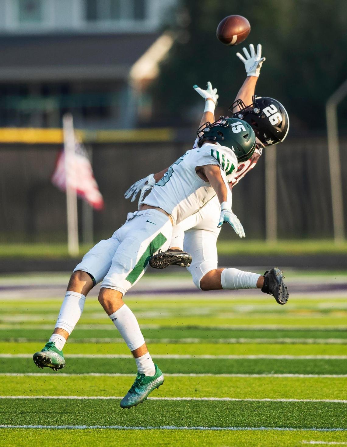 Rocky Mountain wide receiver Jeff Thompson hauls in a long pass over Eagle’s Dallas Sargent on Saturday.